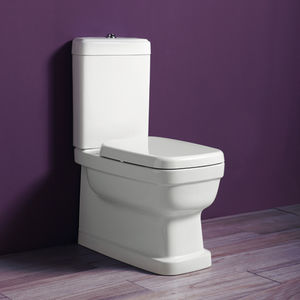 WC da appoggio / monoblocco / in ceramica / con placca di scarico