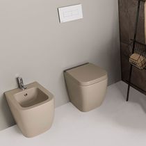 WC da appoggio / in ceramica / con sciacquone...