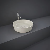 Lavabo sospeso / tondo / in ceramica / moderno