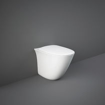 WC da appoggio / in ceramica / senza brida