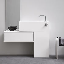 Lavabo da terra / in Corian® / con cassetti...
