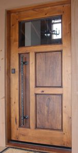 porta d'ingresso / a bilico / in legno / in acciaio