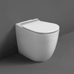 WC da appoggio / filomuro / in ceramica / con sciacquone ad incastro