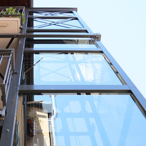 ascensore idraulico / per il settore terziario / ad uso residenziale / per edificio alto
