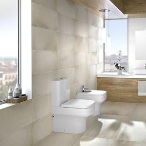 WC da appoggio / in ceramica / senza brida