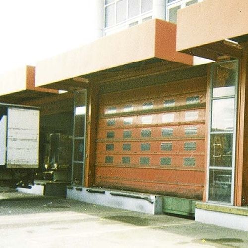 Porta industriale sezionale - NERGECO - in metallo / di sicurezza / automatica