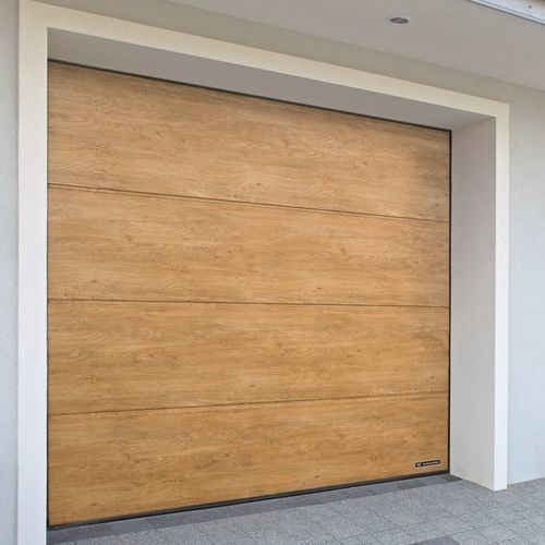 Porta in acciaio galvanizzato per garage - UNIPRO - WISNIOWSKI - sezionale / in schiuma di poliuretano / automatica