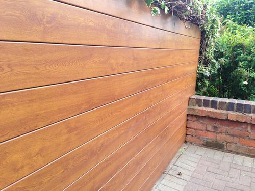 Rivestimento di facciata in pannelli - WeatherFAST Ltd - in PVC / con scanalature / aspetto legno