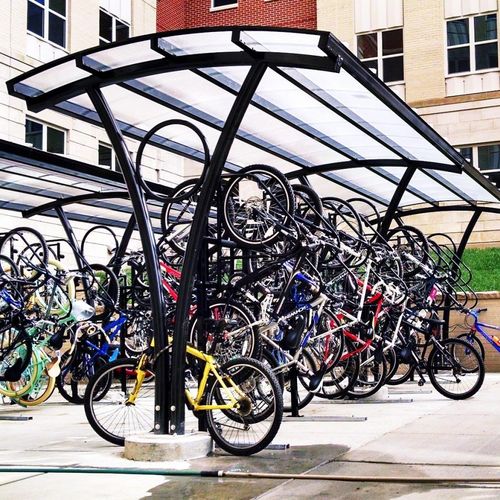 Pensilina per biciclette con copertura in policarbonato - AERO - Brasco International Inc. - in acciaio / in alluminio / per spazi pubblici