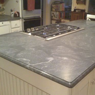 Piano di lavoro in granito - VIRGINA MIST - WALL GRANITE SERVICE SRL - da cucina / nero / con bordi arrotondati
