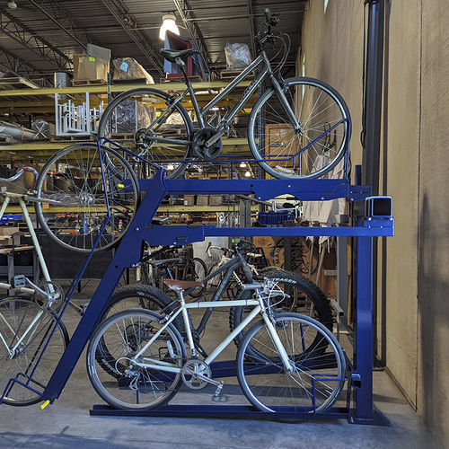Rastrelliera per biciclette a pavimento - BIKE BOOST STORAGE - Madrax - con sistema di sicurezza / a due livelli / da interno