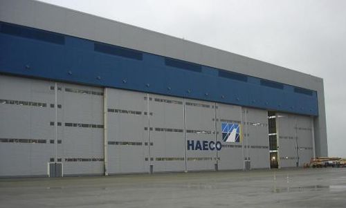 Porta industriale scorrevole - ESAVIAN : TYPE 126 - Jewers Doors - in acciaio / a tenuta stagna / per hangar