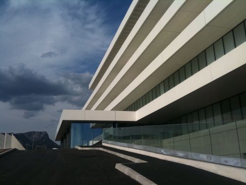 Rivestimento di facciata in pannelli - ACRYTHERM® - REBETON - in composito / levigato / aspetto pietra