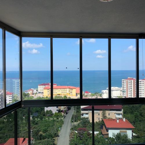 Vetrata scorrevole - ICS - BKS balcony glazing systems - a libro / in alluminio / a doppi vetri