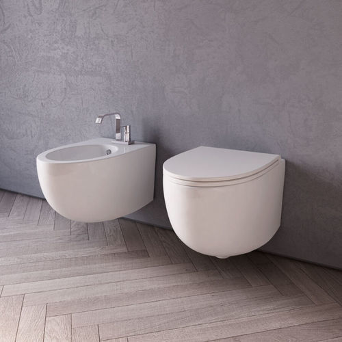 WC da appoggio - BOB  - Disenia - sospeso / in ceramica / per uso residenziale