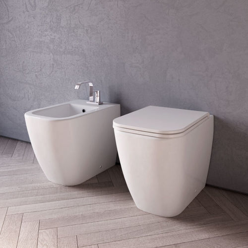 WC da appoggio - TEO  - Disenia - sospeso / in ceramica / per uso residenziale