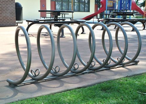 Rastrelliera per biciclette a pavimento - SPIRAL - CANTERBURY DESIGNS - per spazi pubblici / in acciaio inossidabile / in alluminio