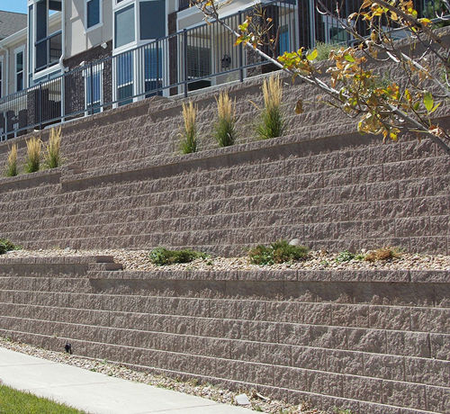 Blocco di calcestruzzo forato - KEYSTONE COMPAC - PAVESTONE - per muro di contenimento / incastrabile / aspetto pietra