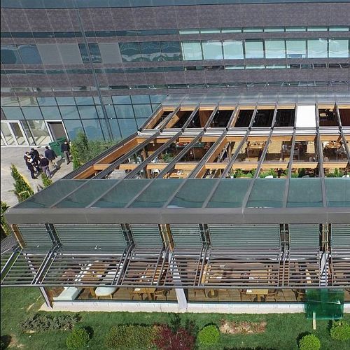 Copertura vetrata in alluminio - SOLAGLIDE - Evergreen Solutions - in acciaio / a motore / a doppi vetri