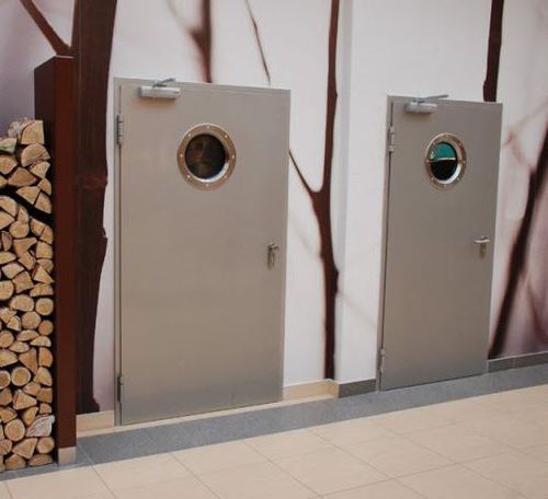 Porta di servizio - Gutkowski - in acciaio / battente / con oblò