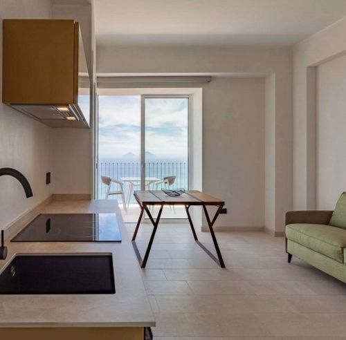 Tavolo contemporaneo - EQUILIBRI - Trackdesign - in rovere / con supporto in acciaio COR-TEN® / quadrato