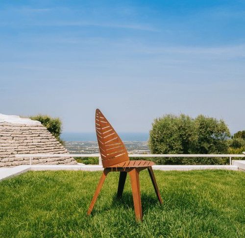 Sedia design originale - LILA - Trackdesign - da giardino / in acciaio COR-TEN® / con supporto in metallo