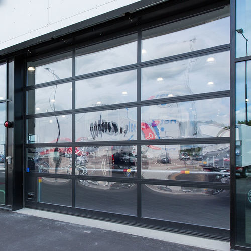 Porta industriale sezionale - OH1042FG  - ASSA ABLOY Entrance Systems - in alluminio / automatica / a prova di vento