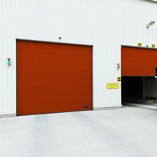 Porta industriale sezionale - OH1042S  - ASSA ABLOY Entrance Systems - in lamiera d'acciaio / automatica / a prova di vento