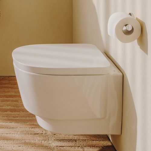 WC sospeso - TURA - ROCA - in ceramica / per uso residenziale / rotondo