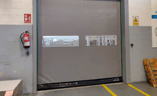Porta industriale avvolgibile - Manusa - a strisce flessibili / avvolgibile / in acciaio inox 304