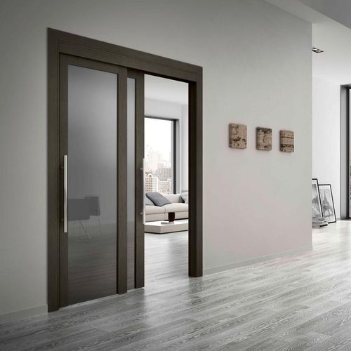 Porta da interno - ROMAGNOLI - in legno / scorrevole / a bilico con asse laterale
