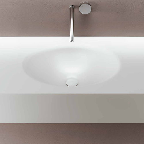 Lavabo integrato - SMOOTH - PLANIT - in Corian® / con piano integrato / ovale