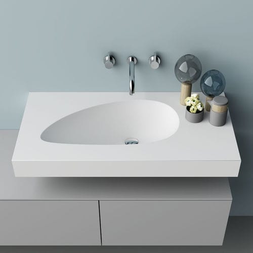 Lavabo integrato - WING - PLANIT - in Corian® / con piano integrato / curvo