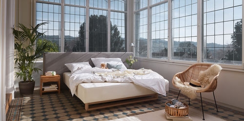 Letto matrimoniale - TITLIS - HÜSLER NEST - contemporaneo / imbottito / con testiera