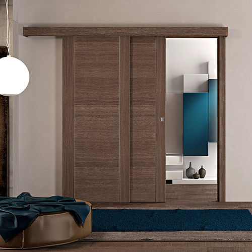 Porta da interno - Infinita Rovere Mocaccino - PAIL SERRAMENTI - in laminato / telescopica / contemporanea