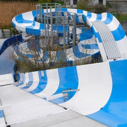 Scivolo girevole - MAJESTIC MOUNTAIN - TECNOPISCINE INTERNATIONAL - per parco acquatico / per ciambelle gonfiabili