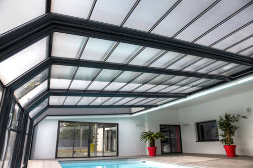 Copertura per piscina a parete - CONSERVATORY - ABRISUD - telescopica / in acciaio inossidabile / con azionamento manuale