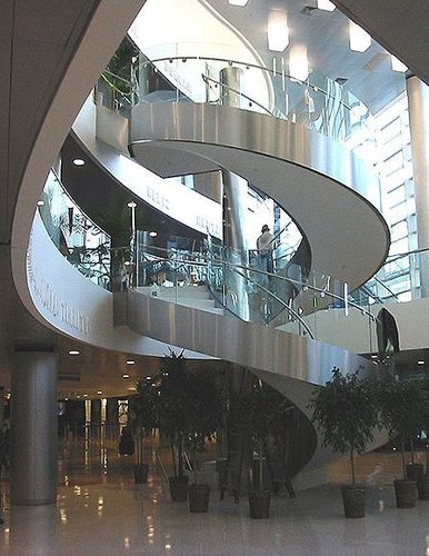 Scala curva - 26903  - Couturier Iron Craft - con gradini in legno / con struttura in metallo / per edificio ad uso pubblico