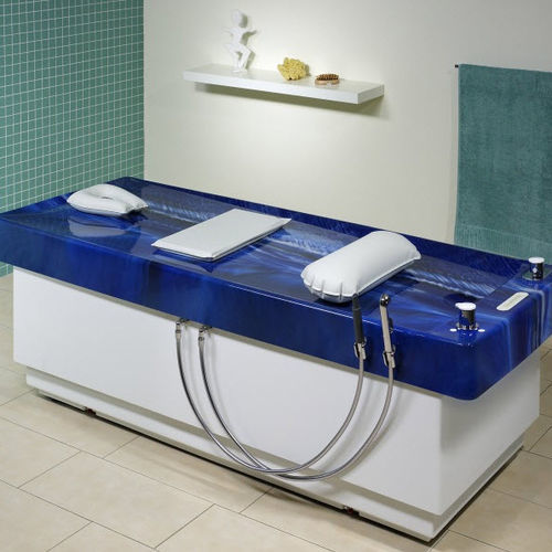 Lettino per massaggi elettrico - ORIENT-ALIMA - Trautwein - fisso / in acrilico / in granito