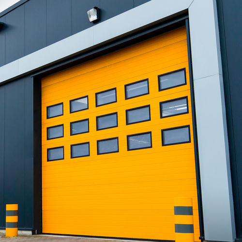 Porta industriale sezionale - FLEXIDOOR SA - in lamiera d'acciaio / automatica / a prova di vento