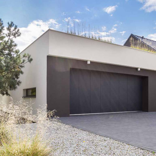 Porta da garage in lamiera - SLIDE  - FLEXIDOOR SA - sezionale laterale / in alluminio / in acciaio galvanizzato