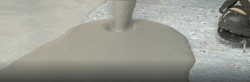 Pavimento in calcestruzzo - FLOWTOP™ - Watco Industrial Flooring - liscio / aspetto cemento / antiscivolo