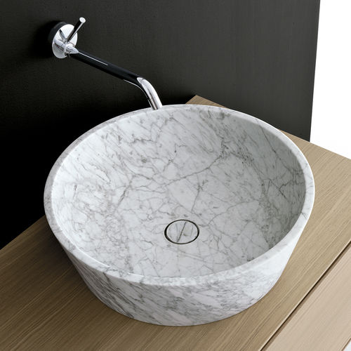Lavabo da appoggio - KONO - SIGN - in pietra naturale / con scaffale integrato / rotondo