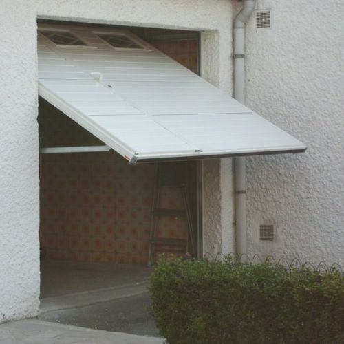 Porta basculante per garage - SMF Services - in acciaio inossidabile / in schiuma di poliuretano / automatica