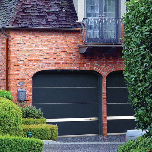 Porta sezionale per garage - MODERN  - KOPRON - in acciaio / automatica / con oblò