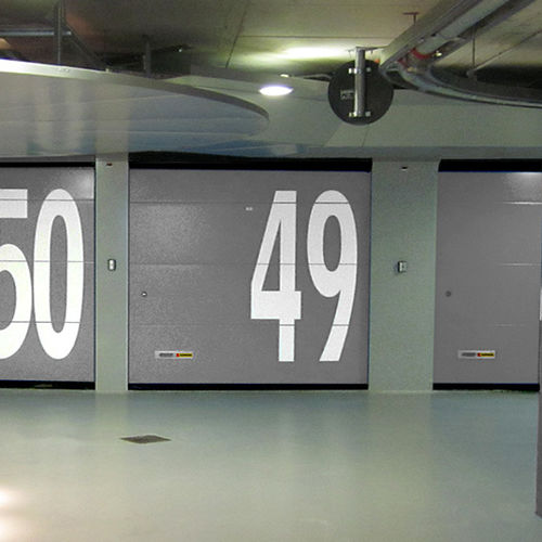 Porta sezionale per garage - KOPRON - in acciaio / in lamiera forata / automatica