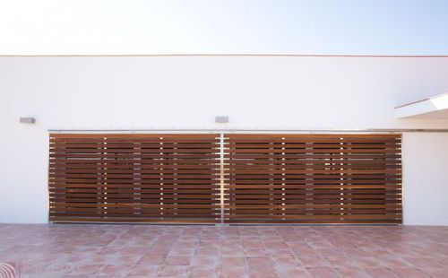 Porta per esterni - PIRBA - in legno / in acciaio inossidabile / scorrevole