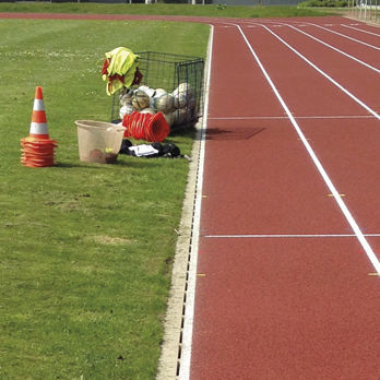 Canaletta con griglie - Sport Slot Channel - ACO Building Drainage - a fessura / in calcestruzzo a polimeri / per campo sportivo