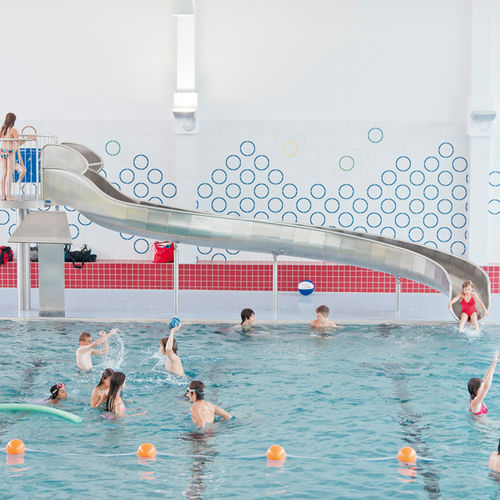 Scivolo girevole - INDOOR EGGENSTEIN-LEOPOLDSHAFEN - atlantics GmbH - per piscina pubblica / in acciaio inossidabile