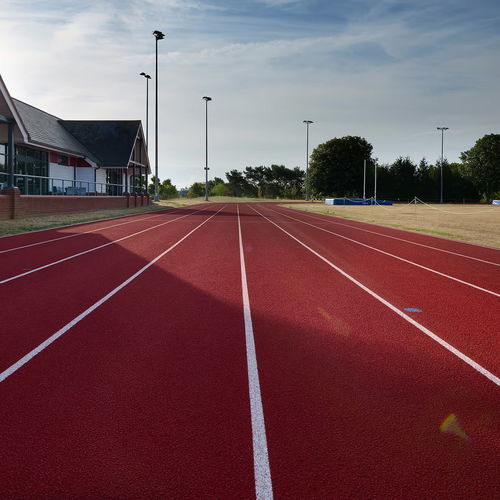 Pavimentazione sportiva da esterno - BS / B2S - Polytan GmbH - in elastomero / in gomma / per scuola
